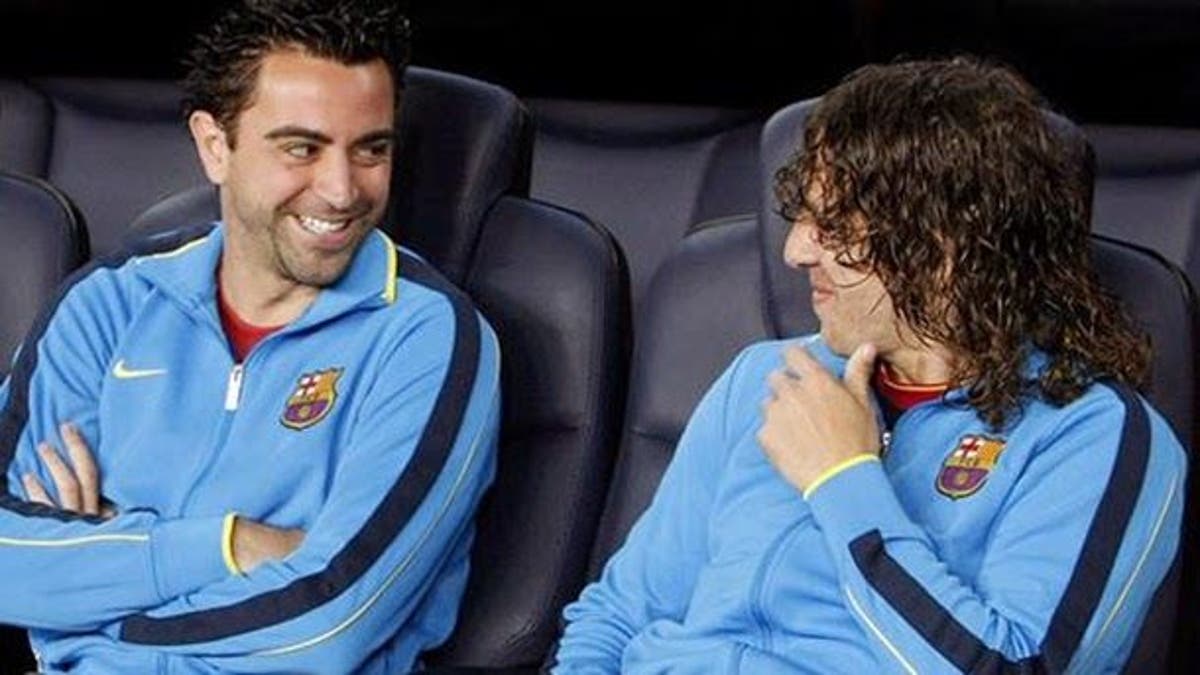 xavi-hern-c3-a1ndez-y-carles-puyol-50613.jpeg